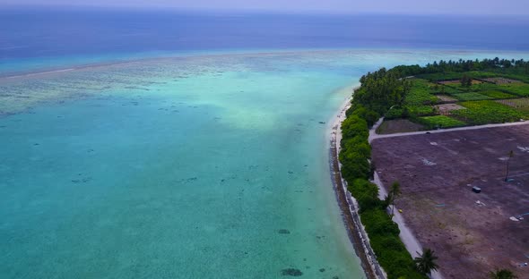 Luxury drone copy space shot of a sandy white paradise beach and aqua turquoise water background 