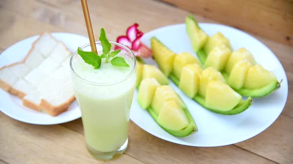 Milk melon Smoothie in glass with Roast bread