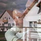 Mother and Little Daughter Stand Embracing and Look Sadly Out the Window - VideoHive Item for Sale