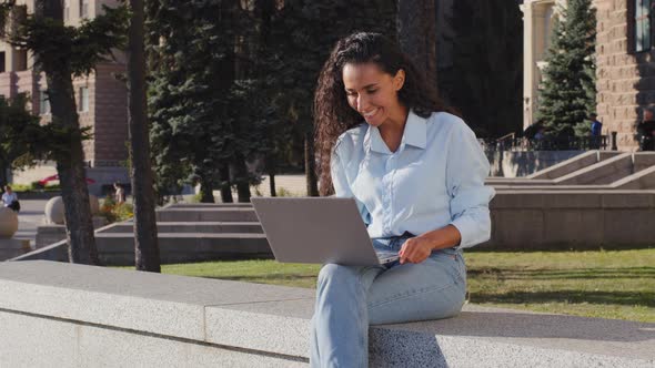 Smiling Happy Cheerful Carefree Young Girl Student Winner Successful Business Woman with Laptop