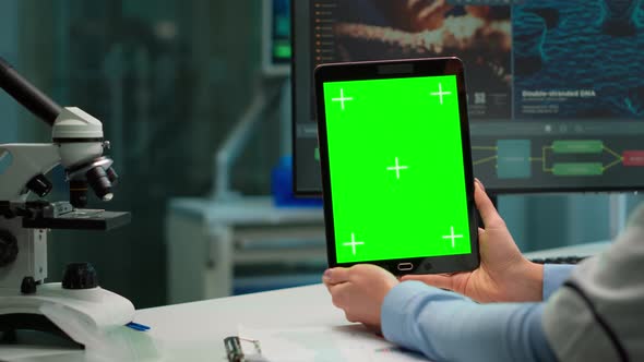 Close Up of Scientist Woman Holding Tablet with Green Mockup