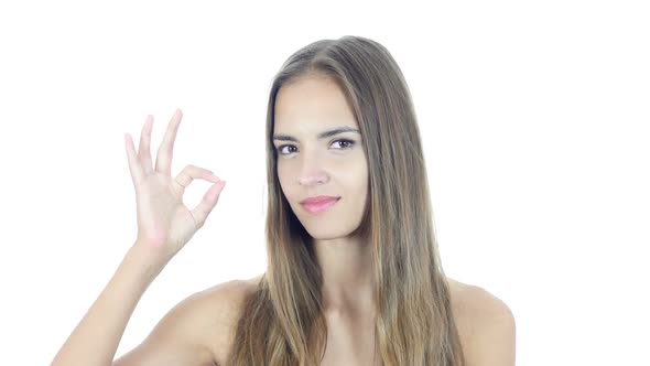 Young Woman Showing Ok Sign, White Background