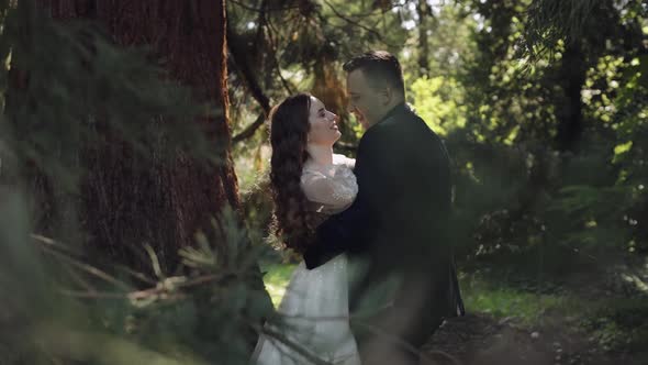 Lovely Newlyweds Caucasian Bride Groom Dancing in Park Making Kiss Wedding Couple Family
