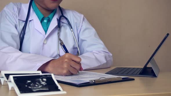 Pregnant Woman and Gynecologist Doctor at Hospital