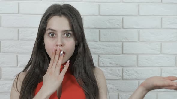 Surprised Girl Offers a Product