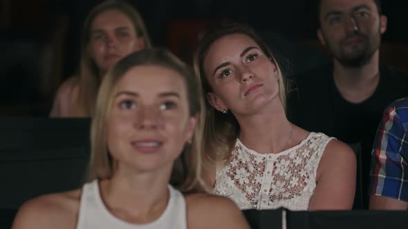 Group of Friends Watching a Movie at the Cinema Theater and Applauding at the End