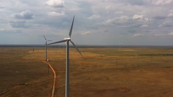 wind farm in the field, cloudy weather