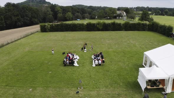 Guests sitting at an outdoor wedding,waiting for the ceremony,Czechia.