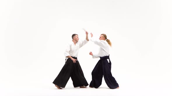 Two Fellows Showing Aikido Using Tanto. Isolated, White. Close Up