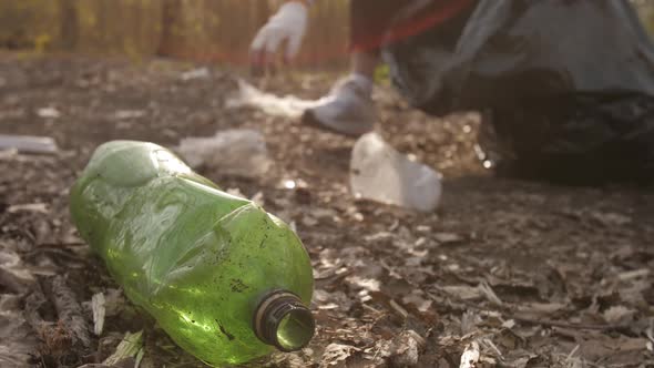 Woman Pick Old Plastic Bottle From the Ground