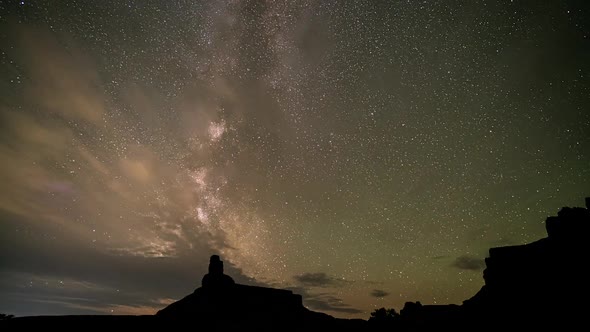 Timelapse of the milky way moving out from behind the clouds at night