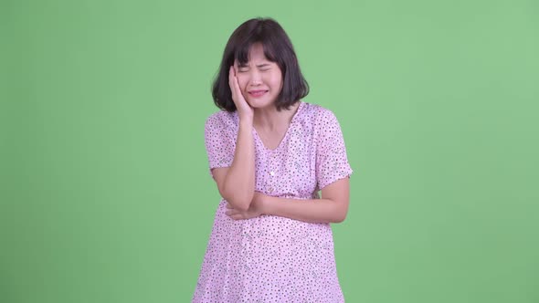 Stressed Asian Pregnant Woman Getting Bad News