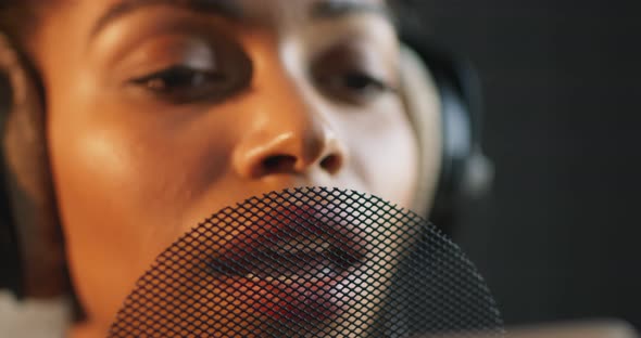 Professional Black Female Singer Recording New Song, Emotionally Singing To Mic at Studio, Close Up