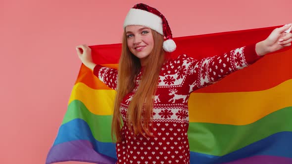 Girl in Christmas Sweater Posing with Rainbow Flag Celebrate Parade Tolerance Same Sex Marriages