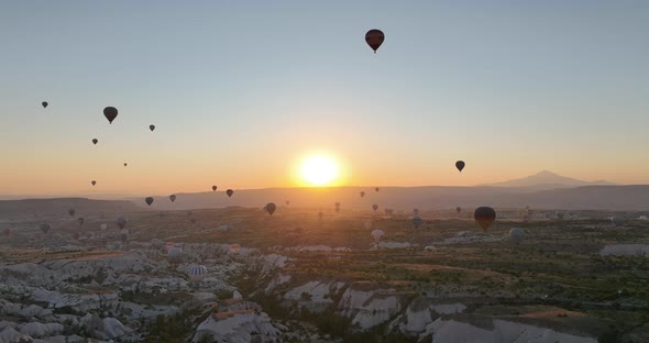 Aerial Cinematic Drone View of Colorful Hot Air Balloon Flying Over Cappadocia