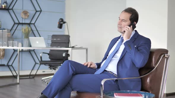 Businessman Celebrating Success During Phone Talk Good News