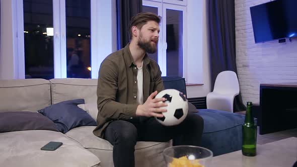 Young Fierce Football Fan Disappointing From the Result of Match and Tired Falling on the Sofa