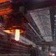 The Crane Gives Out a Mold of Molten Steel and Puts It on a Trolley for Transportation - VideoHive Item for Sale