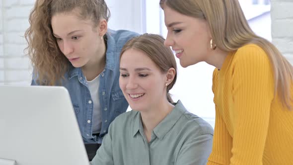 Creative Young Female Designer Doing Video Chat on Computer