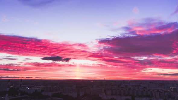 Dark Blue and Purple Clouds Float Above City in Evening