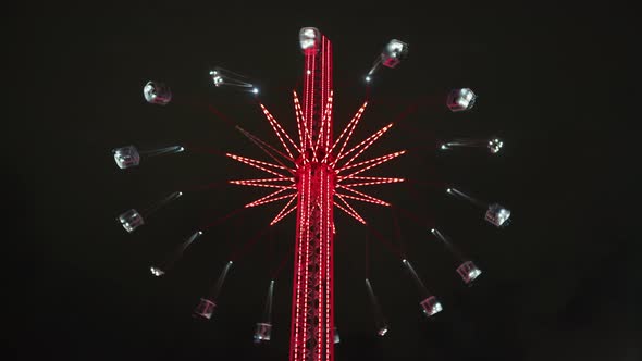 Swing carousel in London, at night