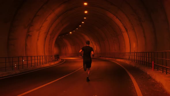 Runner sprinting in the tunnel. Running Concept