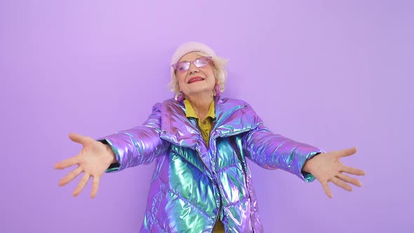 Energetic Pretty Woman of Retirement Age Spread Her Arms and Hugged the Camera, Isolated Background