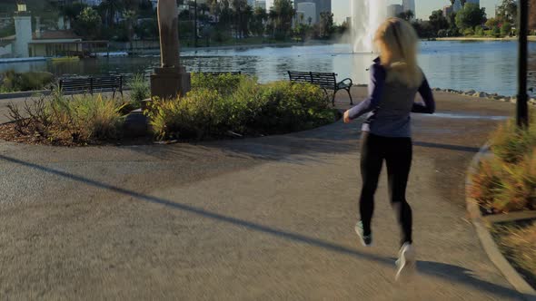 Athletic Woman Jogging In The Park