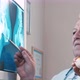 Surgeon and little kid examining X-ray images - VideoHive Item for Sale