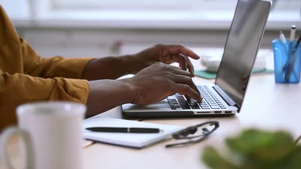 Businessman Working with Laptop and Typing Sitting at Table in Home Office Spbas