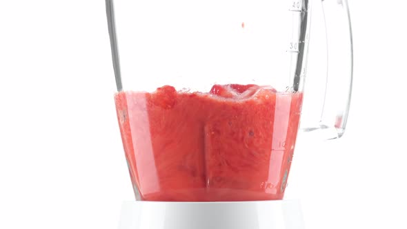 making strawberry smoothie in blender. summer healthy drinks. 4K UHD video