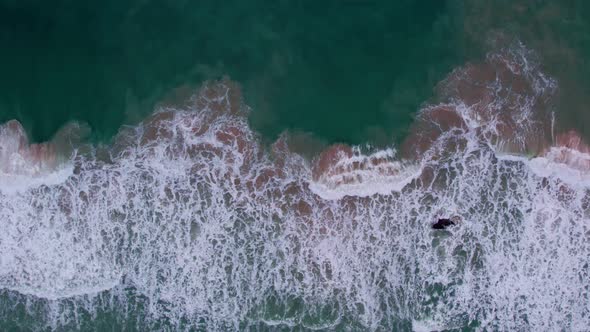 High quality footage.Colorful Sea beach beautiful waves Foaming and Splashing on the beach