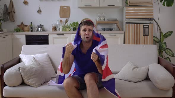 Male Sports Fan of the UK National Team at Home with the United Kingdom Flag