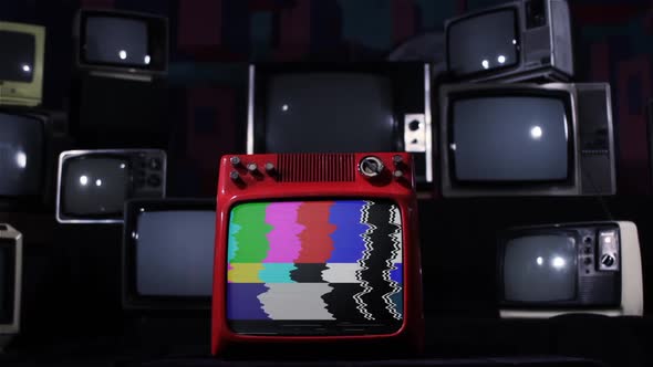 Retro TV turns on Color Bars and Noise over a Pile of Retro Tvs.