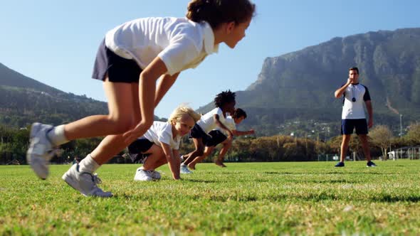 Children running in park during race