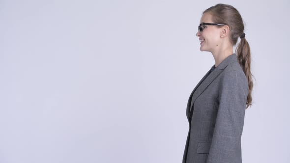 Profile View of Young Happy Businesswoman Smiling and Laughing