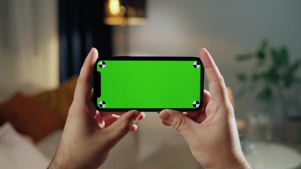 Man Using Smartphone with Chroma Key Closeup