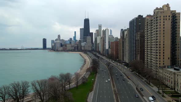 John Hancock Center chicago downtown visit travel aerial view of city, traffic and cars passing by