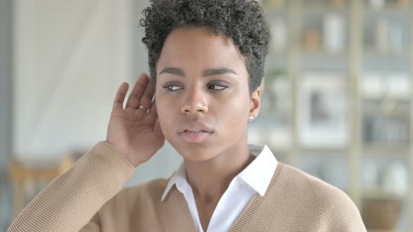 Portrait of Young African Girl with Hand on Her Ear