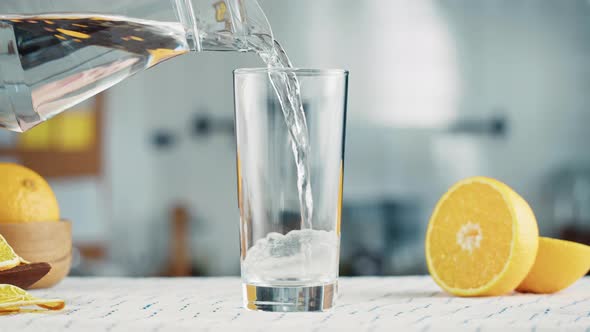 Pouring Water Into Glass Closeup