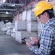 Worker Male Warehouse Worker Engineer Man in a Helmet Working on the Construction Site of the - VideoHive Item for Sale