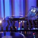 Close Up Dj Hands Disc Jockey Mixing Music on His Deck with His Hands Poised Over the Vinyl Record - VideoHive Item for Sale