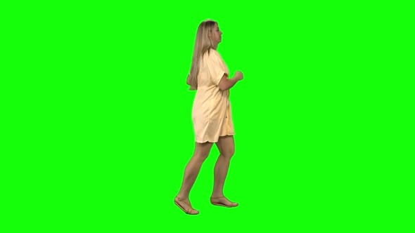 Tanned Blond Woman Is Running with Smile on Green Screen