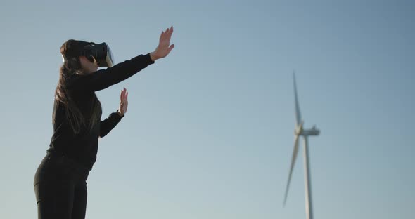 Engineer Wind Farm in VR Glasses. Engineer Using Virtual Reality Headset with VR Glasses