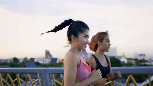 Healthy Female Friends Jogging