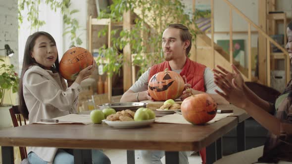 Friends are Looking and Talking About Their Painted Halloween Pumpkins