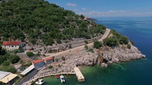 Aerial view of a person going on zipline at Losinj coastline, Croatia.