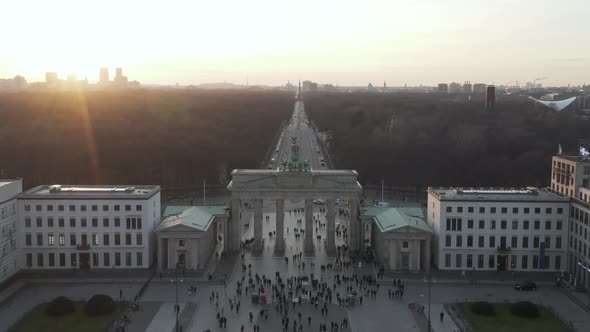 AERIAL: Over Brandenburg Gate with View on Tiergarten and Berlin Victory Column in Beautiful Sunset