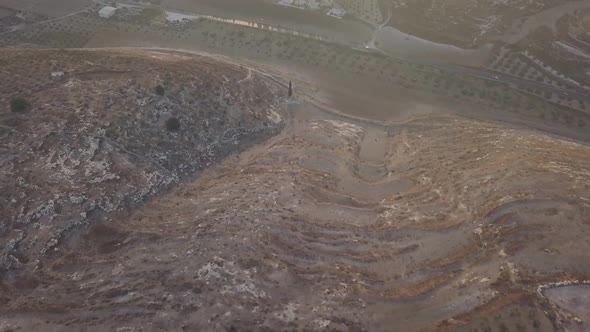 Aerial view of a barren hill going to the town of Arraba Palestine Middle East