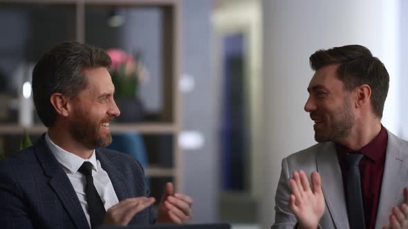 Happy Coworkers High Five Celebrate Corporate Business Deal in Diverse Office